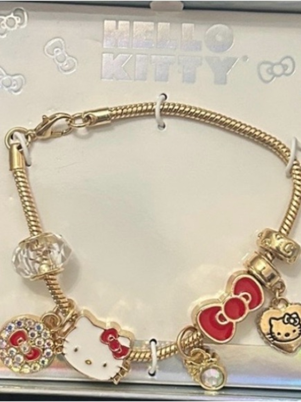 Hello Kitty Gold Bracelet with White Enamel Face and Red Bow